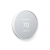 Side view of a snow colored Nest Thermostat in heating mode set to 70 degrees, showing indoor temperature of 72 degrees on grey background